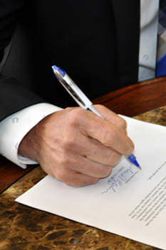 lawyer signing contract