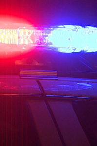 police car with lights on in evening